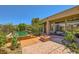 Beautiful backyard with pool, spa, patio area, desert landscape, and luxurious outdoor living space at 4 Dry Brook Trl, Henderson, NV 89052