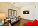 Charming bedroom features plantation shutters, a ceiling fan, and a flatscreen tv at 4 Dry Brook Trl, Henderson, NV 89052