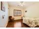 This bedroom has wood floors, a ceiling fan, and plantation shutters at 4 Dry Brook Trl, Henderson, NV 89052