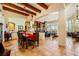Open dining space with wood table, view to living area, and decorative lighting at 4 Dry Brook Trl, Henderson, NV 89052