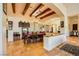 Elegant dining room with exposed beam ceiling and plenty of space for entertaining at 4 Dry Brook Trl, Henderson, NV 89052