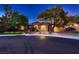 Charming single story home showcasing mature trees and a manicured front yard at 4 Dry Brook Trl, Henderson, NV 89052