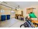 A cluttered garage with storage, bicycles and workout equipment at 4 Dry Brook Trl, Henderson, NV 89052