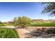 Scenic golf course with mature trees and manicured greens nestled within a beautiful community at 4 Dry Brook Trl, Henderson, NV 89052
