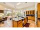 Bright kitchen boasts granite countertops, stainless appliances, and a large island with seating at 4 Dry Brook Trl, Henderson, NV 89052