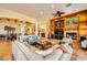 Expansive living room with fireplace, open layout, and plenty of seating options at 4 Dry Brook Trl, Henderson, NV 89052