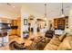 Spacious living room flows into the open-concept kitchen. Neutral colors and tile floors throughout at 4 Dry Brook Trl, Henderson, NV 89052