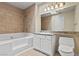 Bathroom features a bathtub and shower, granite countertop, and a toilet at 4050 Pacific Harbors Dr # 229, Las Vegas, NV 89121