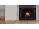 Cozy fireplace, with tile surround, warms the spacious living room featuring hardwood floors at 4050 Pacific Harbors Dr # 229, Las Vegas, NV 89121