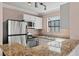 Well-equipped kitchen featuring granite countertops and stainless steel appliances at 4050 Pacific Harbors Dr # 229, Las Vegas, NV 89121