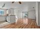 Open-concept living space featuring hardwood floors, sliding door access, fireplace and stainless steel appliances at 4050 Pacific Harbors Dr # 229, Las Vegas, NV 89121