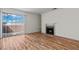 Inviting living room featuring hardwood floors, natural light, and a cozy fireplace at 4050 Pacific Harbors Dr # 229, Las Vegas, NV 89121