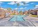A community swimming pool is surrounded by townhomes at 4050 Pacific Harbors Dr # 229, Las Vegas, NV 89121