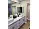 Modern bathroom with double vanity, undermount sinks, and sleek black hardware at 4083 Nook Way # A, Las Vegas, NV 89103