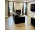Contemporary living room boasts stone fireplace, hardwood floors, and plenty of natural light at 4083 Nook Way # A, Las Vegas, NV 89103