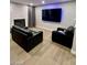 Living room features a large TV and a cozy seating arrangement at 4083 Nook Way # A, Las Vegas, NV 89103