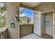 This condo balcony features a storage closet and decorative wall planters, providing both utility and charm at 4400 S Jones Blvd # 2103, Las Vegas, NV 89103