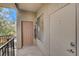 Condo balcony featuring unit doors, with a 'Welcome' sign, and providing resident access to exterior walkways at 4400 S Jones Blvd # 2103, Las Vegas, NV 89103