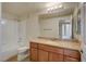 Bathroom featuring a shower-tub combo, granite vanity, and well-lit mirror at 4400 S Jones Blvd # 2103, Las Vegas, NV 89103