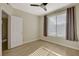 Bedroom features natural light, neutral walls, flooring, and a ceiling fan for added comfort at 4400 S Jones Blvd # 2103, Las Vegas, NV 89103