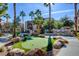 Beautiful outdoor community amenities including a putting green, BBQ grills, and seating areas, surrounded by landscaping at 4400 S Jones Blvd # 2103, Las Vegas, NV 89103