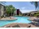 Sparkling community pool and lounging area surrounded by well-maintained landscaping and nearby residences at 4400 S Jones Blvd # 2103, Las Vegas, NV 89103