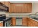 Kitchen featuring stainless appliances and wood cabinets with a view of the counter at 4400 S Jones Blvd # 2103, Las Vegas, NV 89103