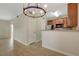 Cozy kitchen with wooden cabinets, stainless steel appliances, and a breakfast bar overlooking the living room at 4400 S Jones Blvd # 2103, Las Vegas, NV 89103