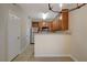Modern kitchen featuring stainless steel appliances, wood cabinetry, and a breakfast bar for casual dining at 4400 S Jones Blvd # 2103, Las Vegas, NV 89103