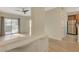 Inviting living area with light floors, modern ceiling fan, and sliding glass doors to a patio at 4400 S Jones Blvd # 2103, Las Vegas, NV 89103
