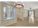Open-concept space featuring wood floors, a modern ceiling fan, and sliding doors to a private balcony at 4400 S Jones Blvd # 2103, Las Vegas, NV 89103