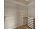 Organized walk-in closet features shelving and storage bins at 4400 S Jones Blvd # 2103, Las Vegas, NV 89103