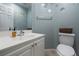 Cozy powder room with white vanity, decorative wall art, and modern fixtures at 4804 Portola Vista Ave, Las Vegas, NV 89139