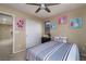 Comfortable bedroom with a ceiling fan, carpeted floors and a closet at 4804 Portola Vista Ave, Las Vegas, NV 89139