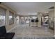 Open-concept living space showcasing tile floors and seamless flow to dining area at 4804 Portola Vista Ave, Las Vegas, NV 89139
