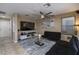 Inviting living room featuring modern decor, ceiling fan, and tile flooring at 4804 Portola Vista Ave, Las Vegas, NV 89139