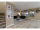 Spacious living room featuring tile flooring, neutral paint, a ceiling fan and lots of light at 4804 Portola Vista Ave, Las Vegas, NV 89139