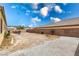 Spacious backyard with gravel and patio seating area is ready for your landscaping ideas at 6636 Brent Scott St, North Las Vegas, NV 89086
