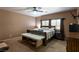 Bedroom with a king bed, bench, and window for natural light, creating a cozy and relaxing atmosphere at 6636 Brent Scott St, North Las Vegas, NV 89086