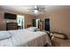 Bedroom featuring a king bed, wood dresser, and neutral-toned walls, creating a comfortable retreat at 6636 Brent Scott St, North Las Vegas, NV 89086