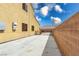 Long concrete driveway provides ample parking space with access to the backyard through a secure gate at 6636 Brent Scott St, North Las Vegas, NV 89086