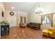 Bright living room featuring hardwood floors and comfortable seating arrangements at 6636 Brent Scott St, North Las Vegas, NV 89086