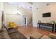 Bright living room with tall ceilings, hardwood floors, and comfortable seating at 6636 Brent Scott St, North Las Vegas, NV 89086
