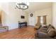 Spacious living room with hardwood floors, a staircase, and a double-door entrance at 6636 Brent Scott St, North Las Vegas, NV 89086