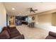 Open concept living room with tile floors that connects to the kitchen, offering plenty of space at 6636 Brent Scott St, North Las Vegas, NV 89086