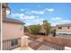 Backyard view from balcony with perimeter block wall and landscaping potential at 7013 Pacific Coast St, Las Vegas, NV 89148