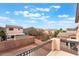 Upstairs backyard view showing block perimeter and neighborhood homes at 7013 Pacific Coast St, Las Vegas, NV 89148