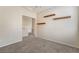 Spacious bedroom with wall shelves and neutral walls at 7013 Pacific Coast St, Las Vegas, NV 89148
