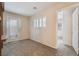 Neutral-toned bedroom with natural light, and a door leading to a private outdoor space at 7013 Pacific Coast St, Las Vegas, NV 89148