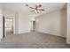 Minimalist bedroom with a ceiling fan and large closet at 7013 Pacific Coast St, Las Vegas, NV 89148